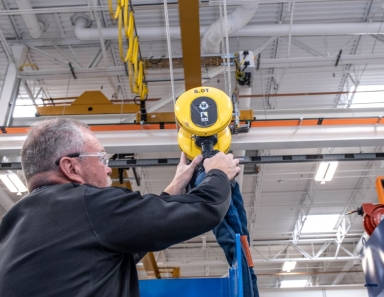 Factory interior showing R&M Materials Handling equipment handling heavy materials