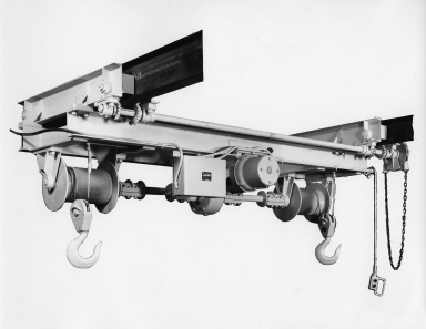 Underhung twin hook hoist used in a factory environment