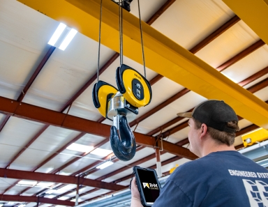 R&M Materials Handling engineered systems setup in an industrial facility