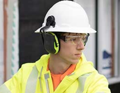 Worker wearing PPE while operating crane equipment